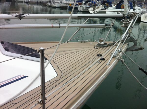 Finally finished a full westerly refit in weathered flexiteek with toe-rails...