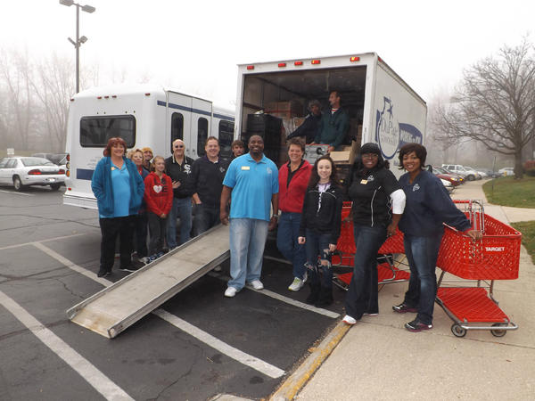 Township Supervisor Bill Mayer, Trustees Alyssia Benford, Sheldon Watts, delivering Turkey Baskets to the Seniors!