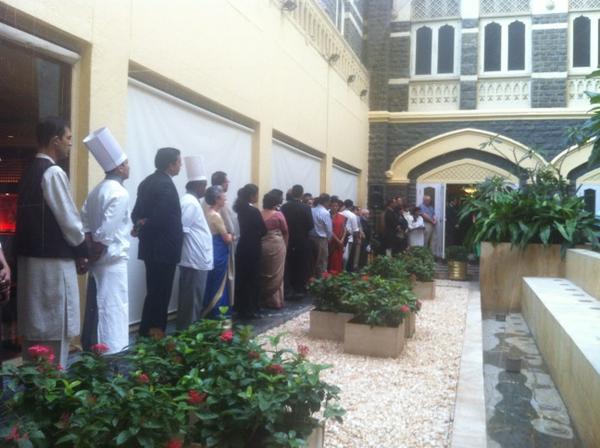 Staff at the Taj Mahal hotel in Mumbai gather to remember the victims of the 26/11 terrorist attacks