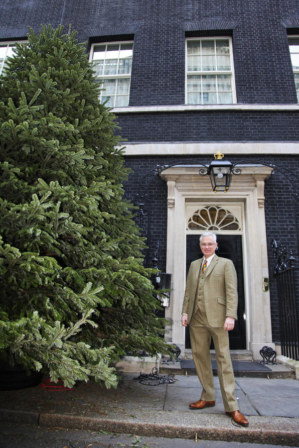 BCTGA's tweet photo. Here's 'Champion Tree Grower' Mike Craig and his Nordmann Fir outside of 10 Downing St. Congratulations Mike! http://t.co/tp0MrI1n
