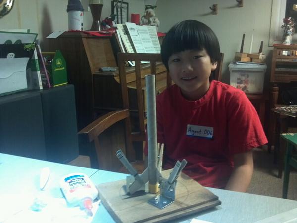 c_nieuwenhuis's tweet image. Agent 006 building a model rocket. Note the home made fin alignment rig.