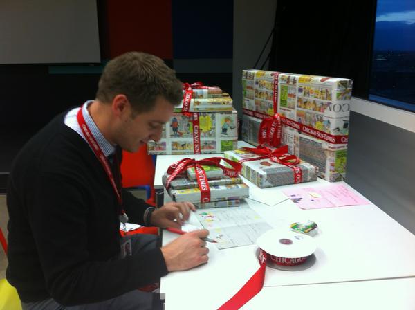 Wrapports's tweet image. Brad in marketing writing a special note to go along with his @Suntimes Letters to Santa gifts! @bradmessinger