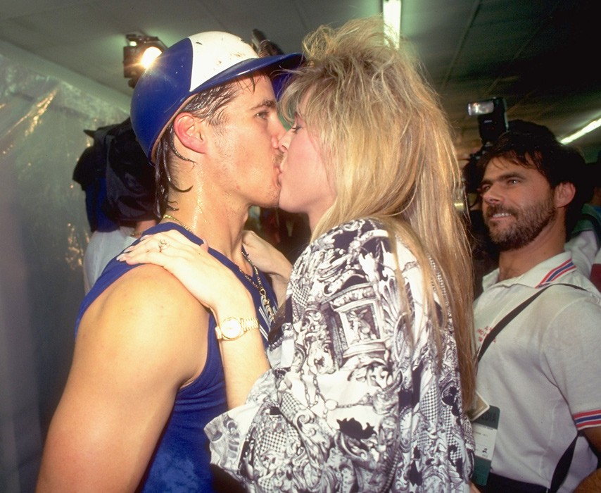 SI Vault on X: You get the feeling Kathy Borders and the creepy guy  watching them are much more into this kiss than Pat Borders is:   / X