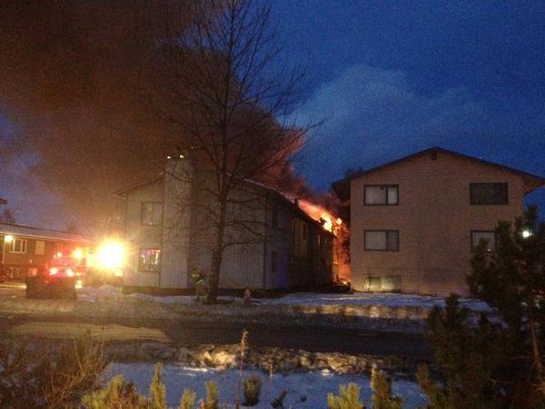 RT <a href="/adndotcom/">Anchorage Daily News</a>: PHOTO: Firefoghtera battling a large apartment fire at Eureka and 34th in Midtown. A tower of smoke.