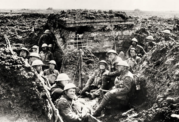WW1IEPER1917's tweet photo. Cold, muddied and tested by battle, Canadian soldiers take a breather, 1917. http://t.co/AaFedc0V