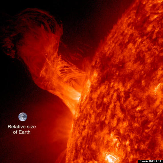HuffPostScience's tweet photo. The New Year's Eve solar flare and its size relative to Earth http://t.co/gbOyZKbI http://t.co/i1MIKHSC