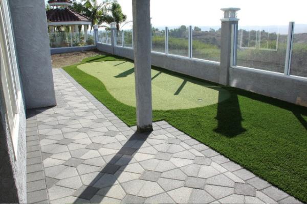 What a fantastic looking backyard with #pavingstones and #syntheticturf from #ModernTurf