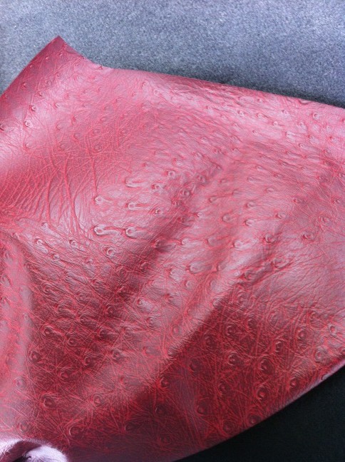 The burgundy faux ostrich leather for reupholstering the inside of the sailboat has arrived!!!! http://t