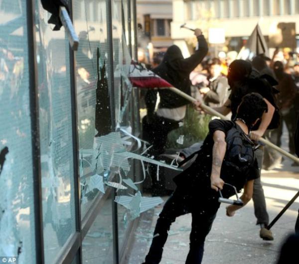 OccupyTV's tweet image. Smashing a bank's windows to defend an idea isn't defending an idea, it's smashing a bank's windows.