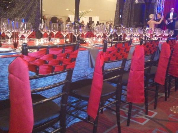 Weave ribbon through chairs for a more modern look. Need more ideas? Contact Champagne Taste Events 972-807-2941 today!