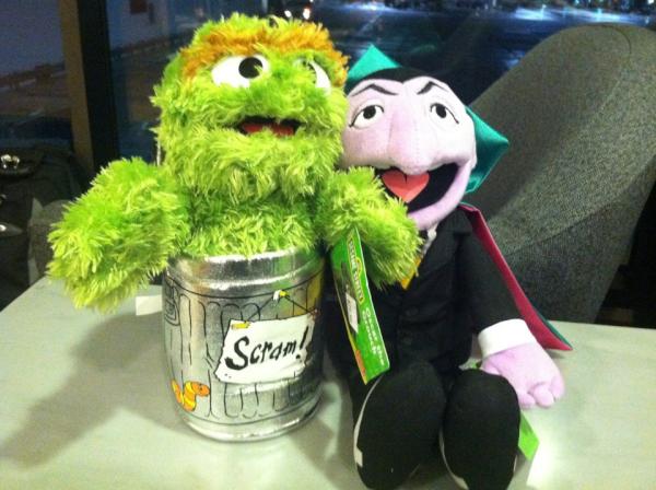 Our flight has been delayed by 6 hours, and we have resorted to playing with Muppets in the Red Carpet Lounge.