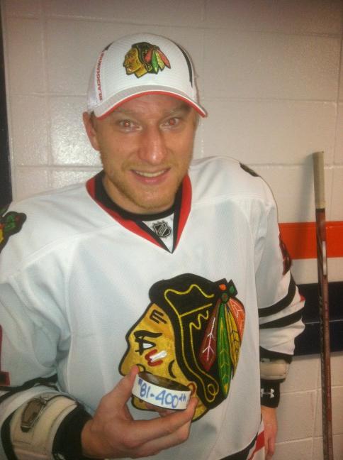 NHLBlackhawks's tweet photo. Marian Hossa shows off the puck from goal #400. Thanks to @FaberBrandon for the photo! #ChiNYI http://t.co/0DTe8YYc