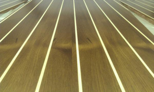 Teak & Holly floors are now varnished and ready for fitting.