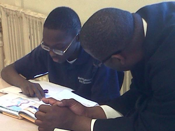 ShannahVaron's tweet photo. Thanks to @titojackson for a great visit to Boston Collegiate! Here's Tito helping a student with history http://t.co/lU5jO9fh