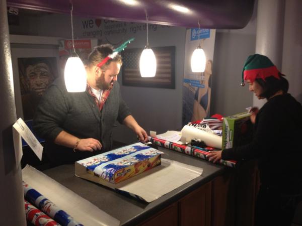 gadventures's tweet photo. Our elves @jontravels and @gadv_joytan getting gifts ready for #gwrap event tomorrow night. #gadv http://t.co/Hgk7e18Y