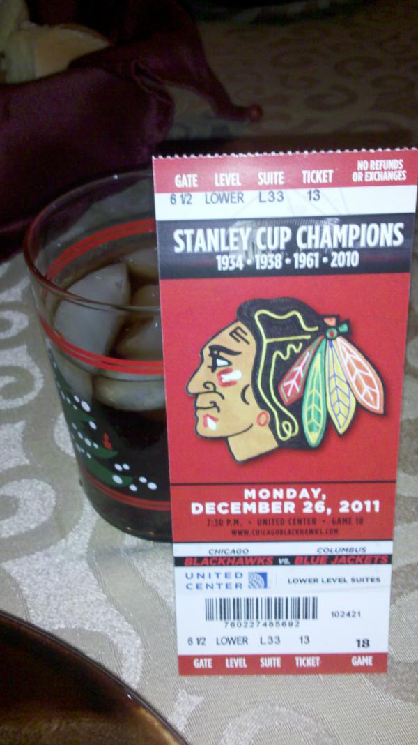 JZimny's tweet photo. Box tickets to the Blackhawks game tomorrow and a rum and coke with my family. Merry Christmas to me. http://t.co/FSd5OiBf