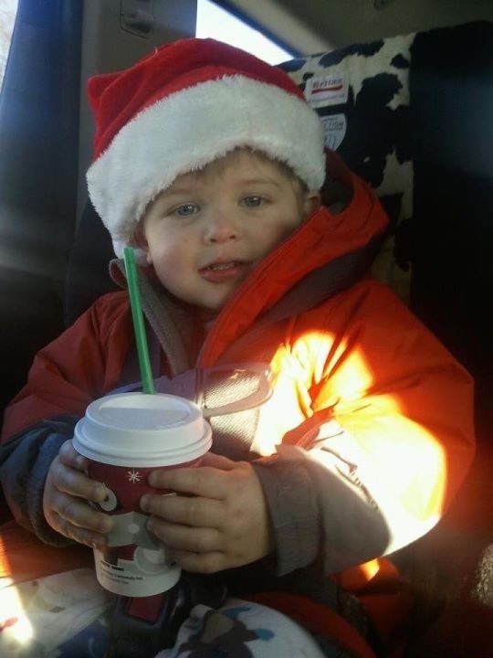 Starting him young...for the record, it's just chocolate milk!!