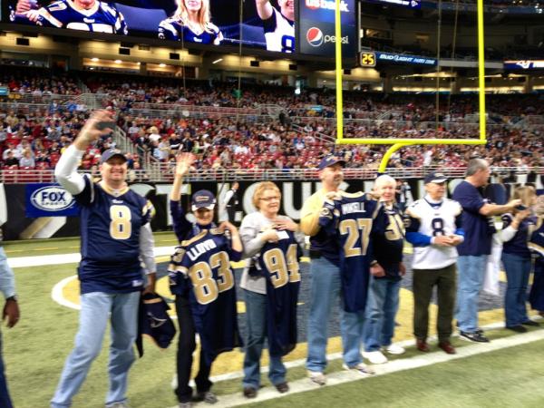 ramsgame's tweet photo. 50 lucky season tickets holders just received autographed jerseys on the field at halftime! http://t.co/WfJOUvOY
