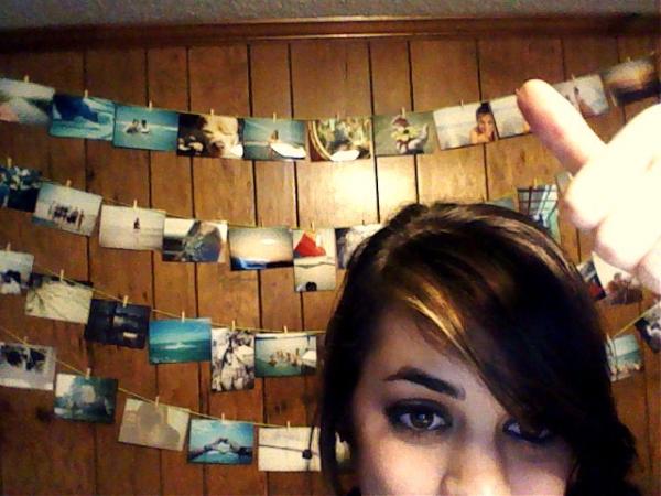 chrisybtemplin's tweet photo. My new clothesline wall! I used mini clothespins and yarn to hang up some of my favorite film photography :) http://t.co/MxMUtVa