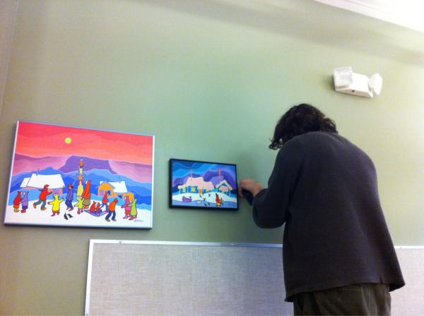 hanging SEVEN ted harrison artworks at monterey middle school!