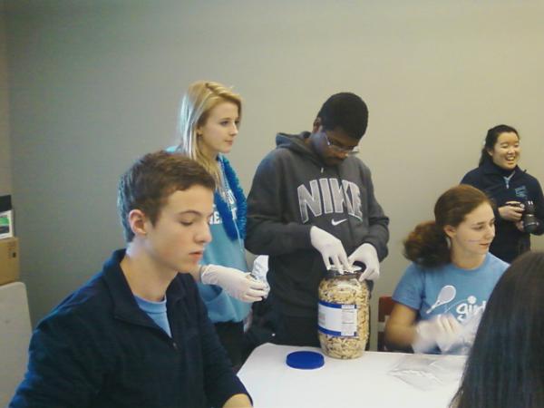 YHSBestBuddies's tweet photo. Terrance and Marianna getting ready to put cookies in bags. http://t.co/6Jp689fT