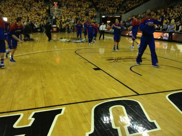 Seats on the floor. If you are watching on ESPN I am wearing a yellow shirt.