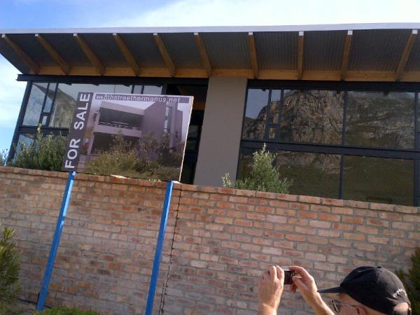 MareliEighthStr's tweet photo. The new signboard is up... We like the reflections in the windows - same as the stunning views from the house! http://t.co/sGmupRyS