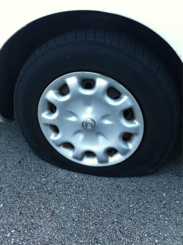 Sumadi's tweet photo. And I thought this one was the good tire!! http://t.co/Q4jVMqao