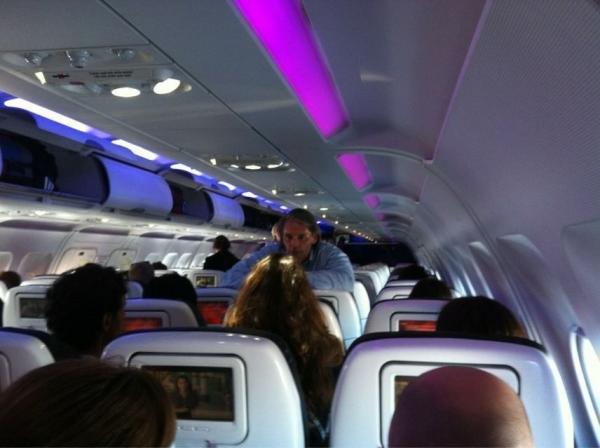 RyanSangha's tweet photo. Virgin CEO David Cush on board and working the aisles DC->LAX. http://t.co/LkD20R6D