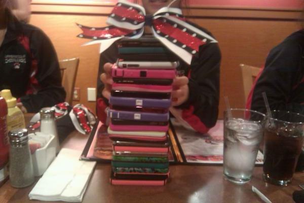 cantbeliebit's tweet photo. the ENORMOUS amount of iPhones that my cheer team has! hahaha #iPhonetower http://t.co/T35AvVs1