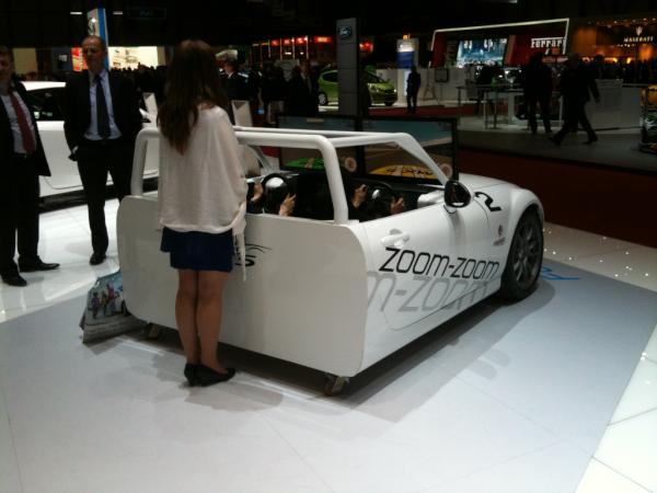 BBC_TopGear's tweet photo. Mazda launches half a car. Attempts to hide laziness with girl. Fails... #TopGearGVA #SIAG @GVAMotorshow http://t.co/kkMHRALV