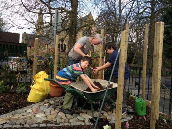 The boys planted the last tree in Fee's garden today for mothers day. Father Mac blessed it after Mass