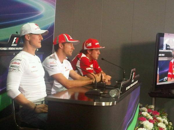 McLarenF1's tweet photo. JB in the FIA press conference at the Sepang Circuit today. It's hot &amp; humid at the track (we're used to Woking!). http://t.co/XcZ8fgji