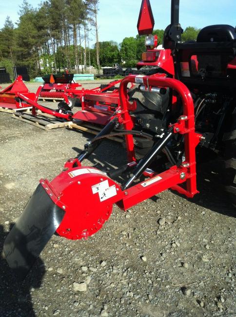 McCormick by Woods stump grinder. Takes tree stumps down 20" below the surface.
