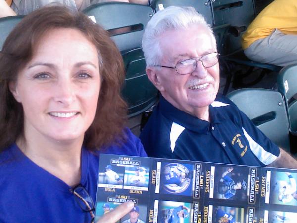 Greg_Glenn's tweet photo. @Loaglenn (proud mom) w/ Papa pointing to baseball card of Cody being handed out prior to game tonite. #geauxtigers #24 http://t.co/0VUnh2ZN