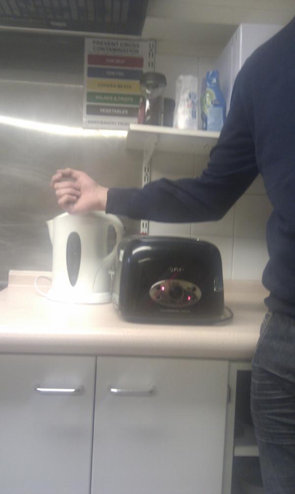 clarkieryan's tweet photo. Leigh drying his arm over the toaster. http://t.co/6esV6PFh