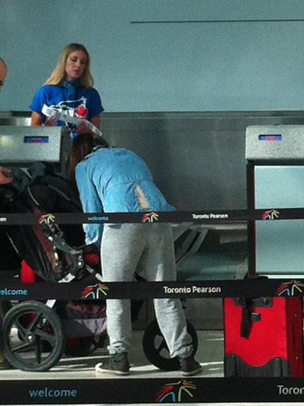 Thesleepingwolf's tweet photo. Very cool! The WestJet counter agents are all wearing @BlueJays shirts.Showing they are the coolest airline http://t.co/0JVRq6Uj