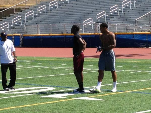 schmahula's tweet photo. Coach Collins getting Antwon Moutra and Damarlo Belcher ready for the NFL. http://t.co/MLshK9Yj