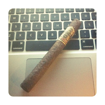 IntimateUpdates's tweet image. Outside a cafe, I sit with a tumbler half full and a #cigar that won't stop burning. Why can't I finish this website?