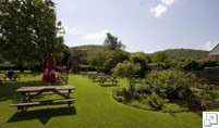 ButcombeBrewery's tweet photo. One of our favourite views in the South West. Trees and hills of the Chew Valley from the lush garden @RingOBellsCM http://t.co/WUYrMGYr
