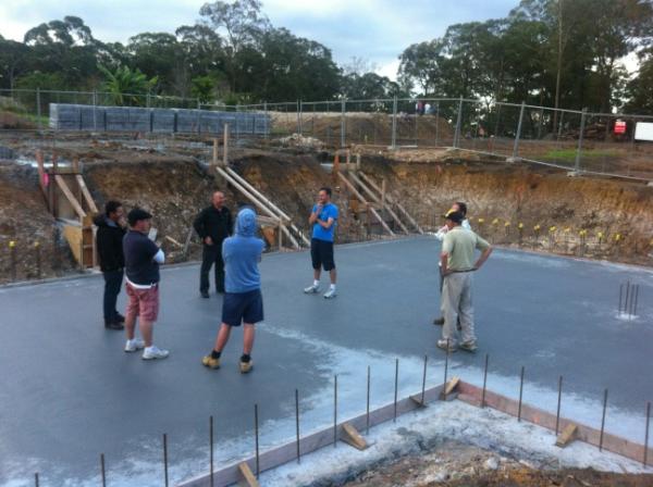 Standing on the new slab. Reflecting on the pleasing progress.