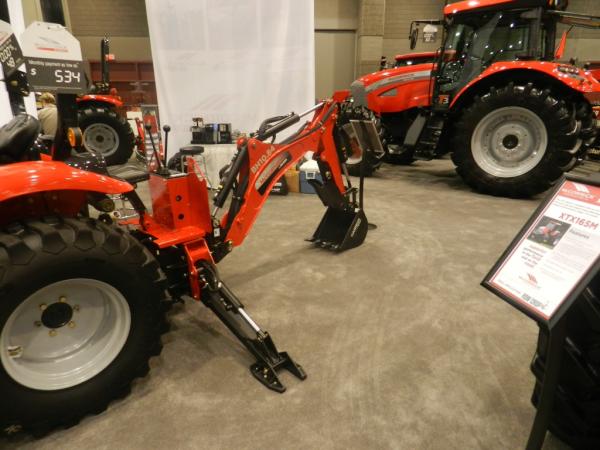 McCormick by Woods Backhoe with Gannon bucket, both attached to an X10.30H tractor