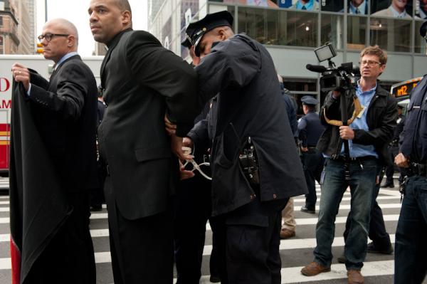 The99Spring's tweet image. When #BankofAmerica buys our democracy, they get bonuses - ppl take action, they get arrested #99spring @the99power