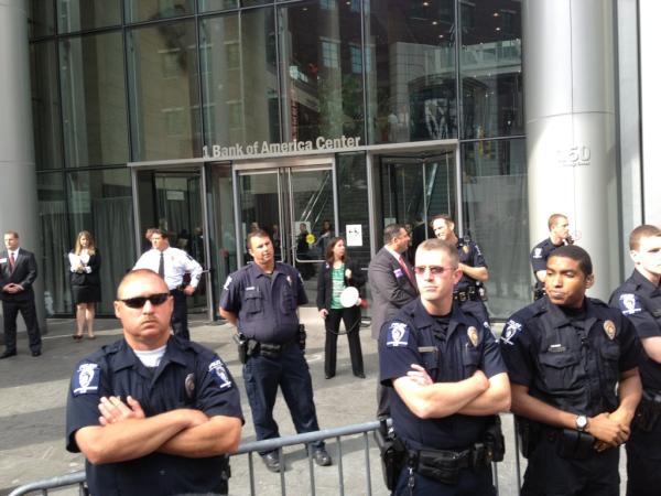 OccupyWallStNYC's tweet photo. That kind of protection ain't free! http://t.co/hZWI7Nnb @OccupyEye:Police protecting BoA. #makeboapay #OccupyCharlotte http://t.co/idYD9ilD