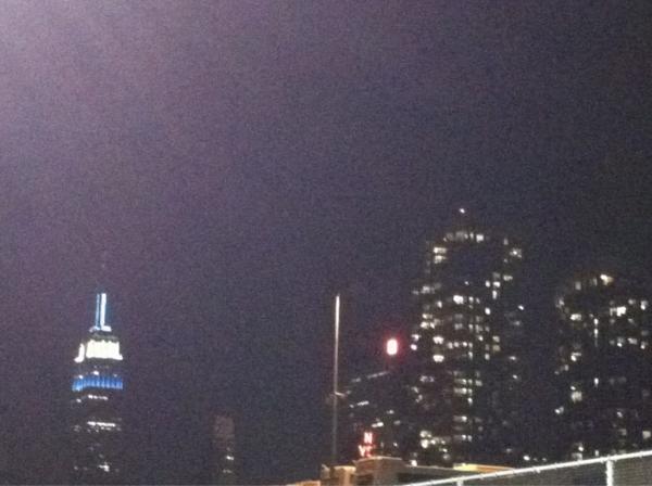 EmpireStateBldg's tweet photo. RT @myceya: check out my photo of the @EmpireStateBldg lit up white and blue for #CU2012. Congrats graduates! ^h http://t.co/NfmBFpP5