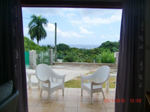 TravelSpree's tweet photo. A view from a villa on a hill, Seychelles http://t.co/8NddQObW