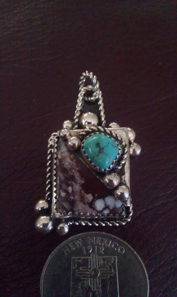 WildHorseDesig1's tweet image. This pendant was just finished by Bill DoBell. Made with solid Sterling Silver with Wild Horse and Turquoise stones.