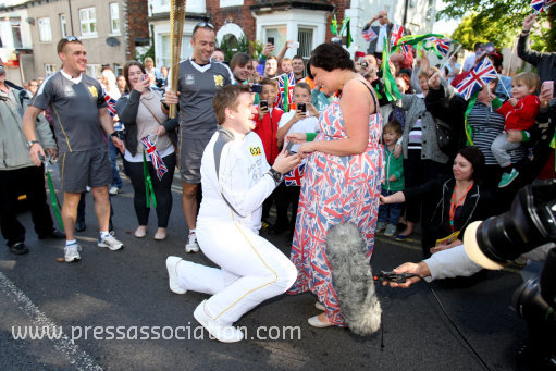 PACommonwealth's tweet photo. The #OlympicTorch has had an eventful morning, witnessing its first proposal! http://t.co/jTDGFAO4