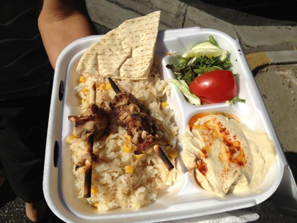 A healthy, authentic chicken plate! Hummus, rice, salad and chicken.