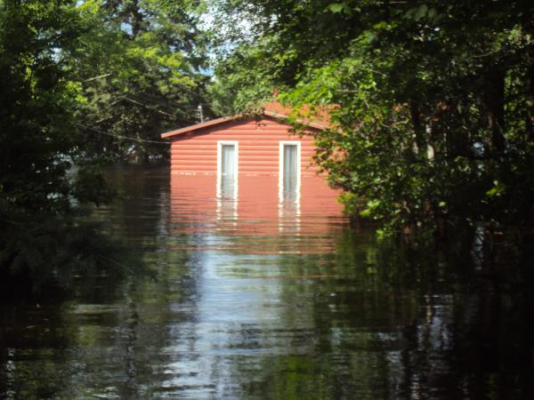 DThomasMPLS's tweet photo. My family's cabin used to be on the Cloquet River. Now it's IN the Cloquet River. #duluthflood http://t.co/2QvBMg2P
